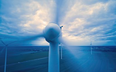 close,up,of,a,wind,turbine,spinning,over,farmers,fields